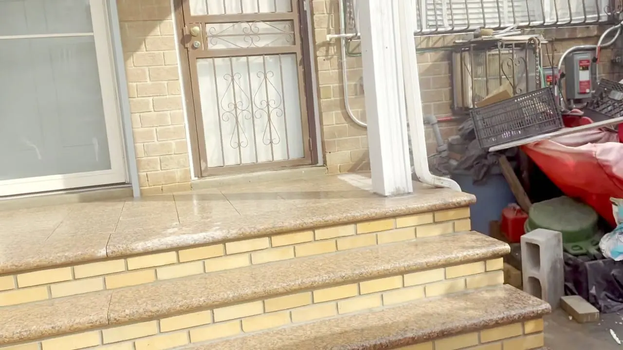 New brick steps with polished granite treads and a granite porch landing at 148 George Street, Brooklyn