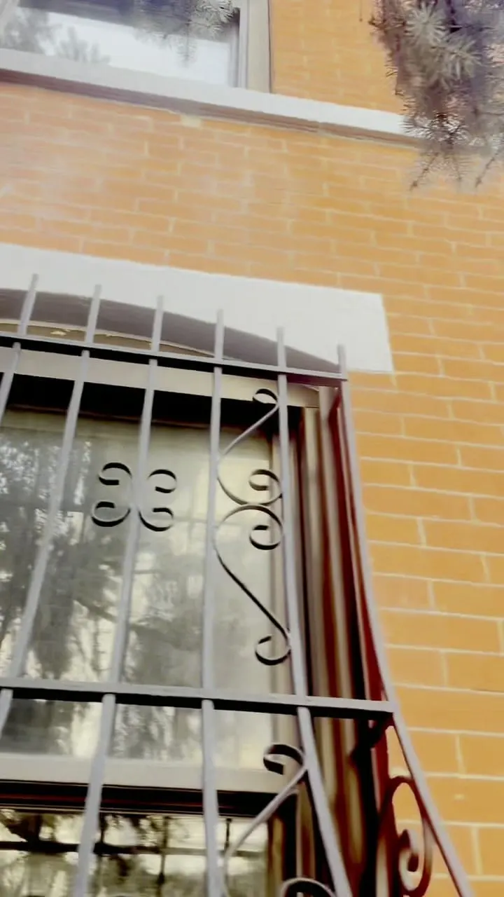 Freshly repointed brick facade with a renewed stone window header at 274 Hoyt Street, Brooklyn